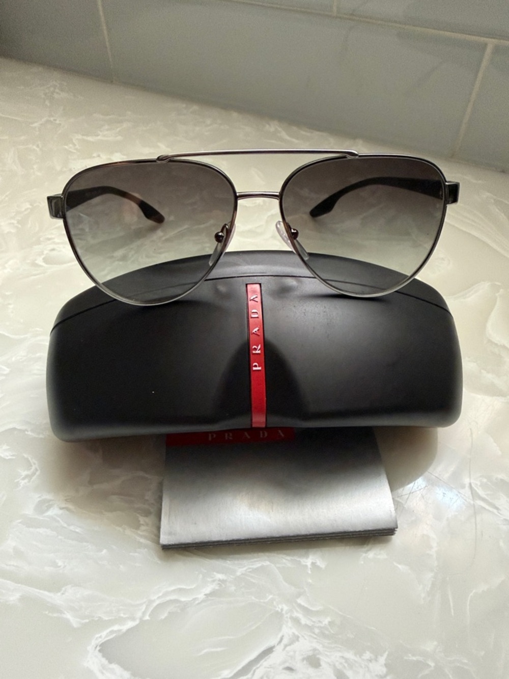 Prada Silver Aviator Sunglasses with Gradient Gray Lenses